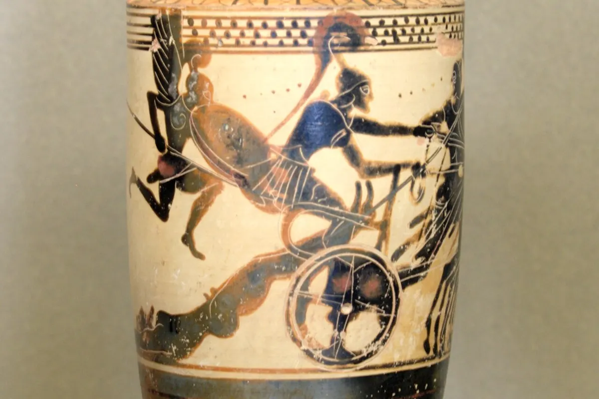 A tall black-figure oil flask with a chariot scene around its shoulder, in a museum case (an Attic vase in the Louvre filed under Achilles and Hector, not the show)